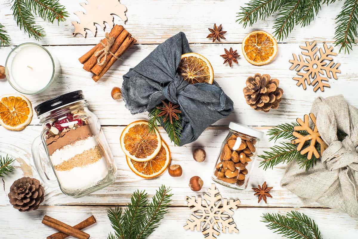 Eco friendly and zero waste Xmas presents wrapped in clothes with natural materials. /c)AdobeStock_392712632_nadianb